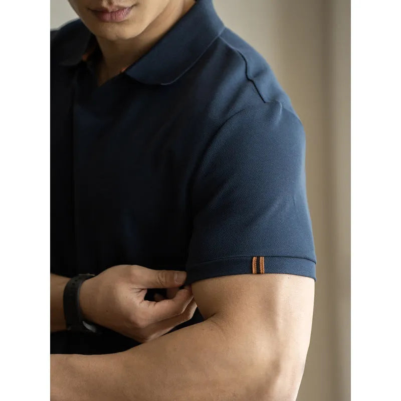 American-style short-sleeved polo shirt in a cotton-polyester blend, shown in blue, black, or white.