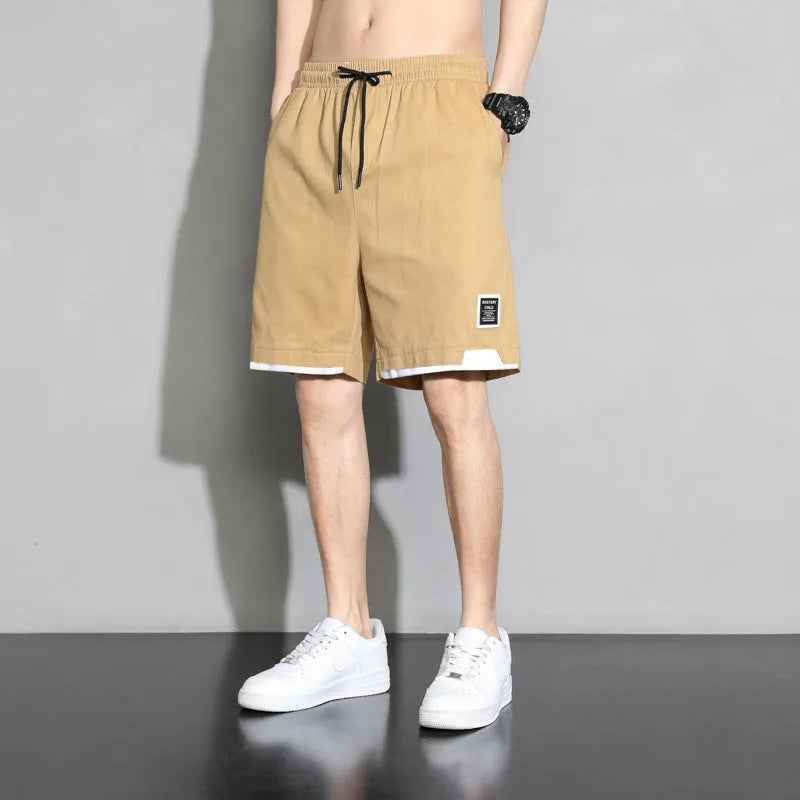 Cotton shorts for boys in black, khaki, or white, showing mid-waist and shorts-length design.