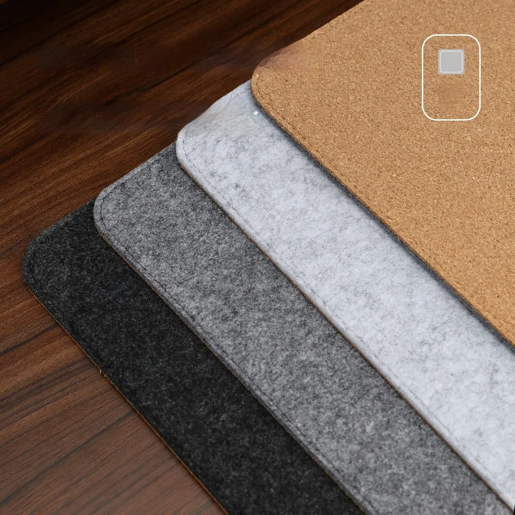 Medium grey felt cork oversized desk mat with Japanese style simple design on a wooden desk.