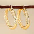 Geometric drop ear clips for women in copper with ring and line design elements