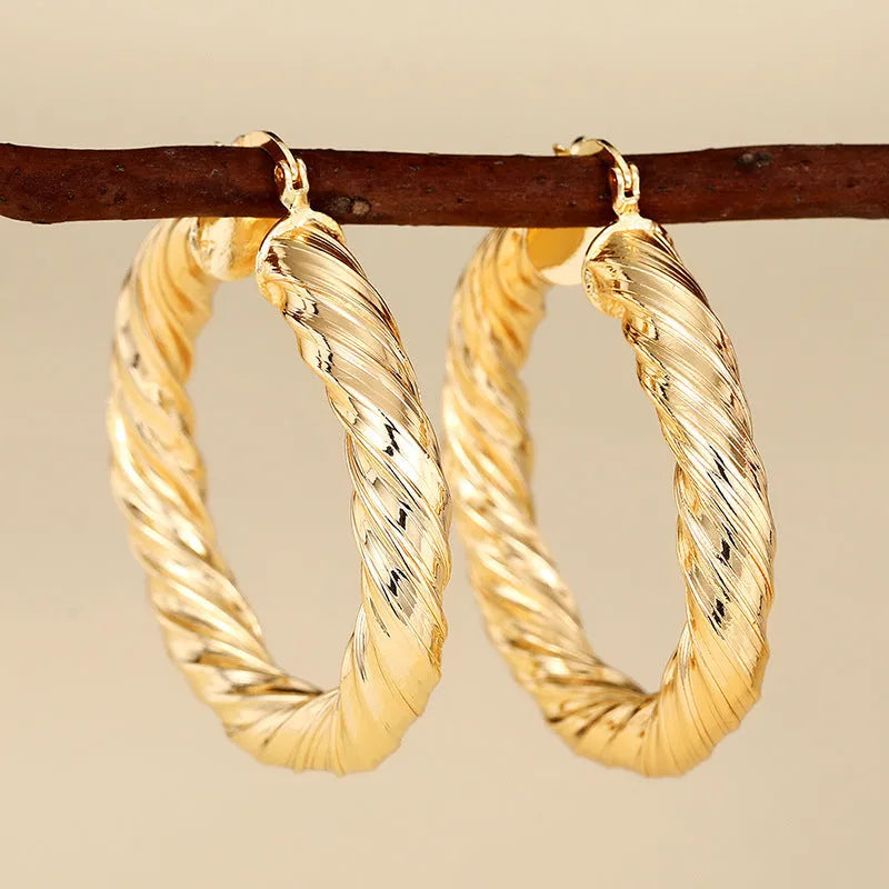 Geometric drop ear clips for women in copper with ring and line design elements