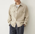 Men's light sand rice casual shirt with a cotton fabric lapel and long sleeves, laid flat.