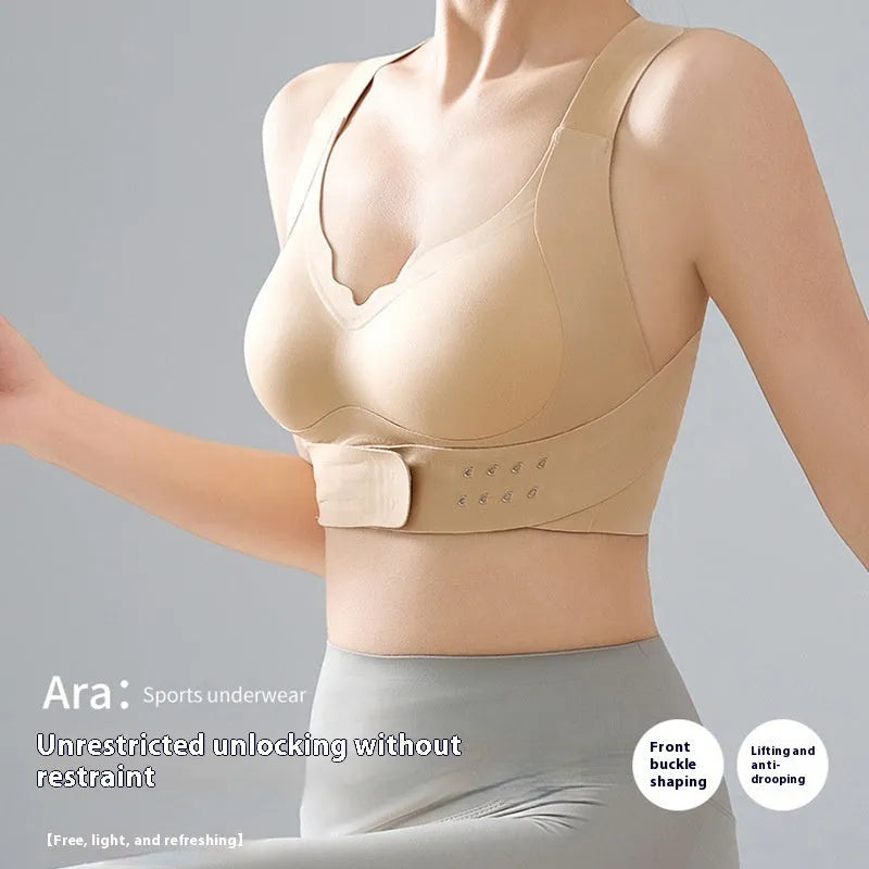 Women's front buckle sports bra in black, white, or nude for yoga and exercise.