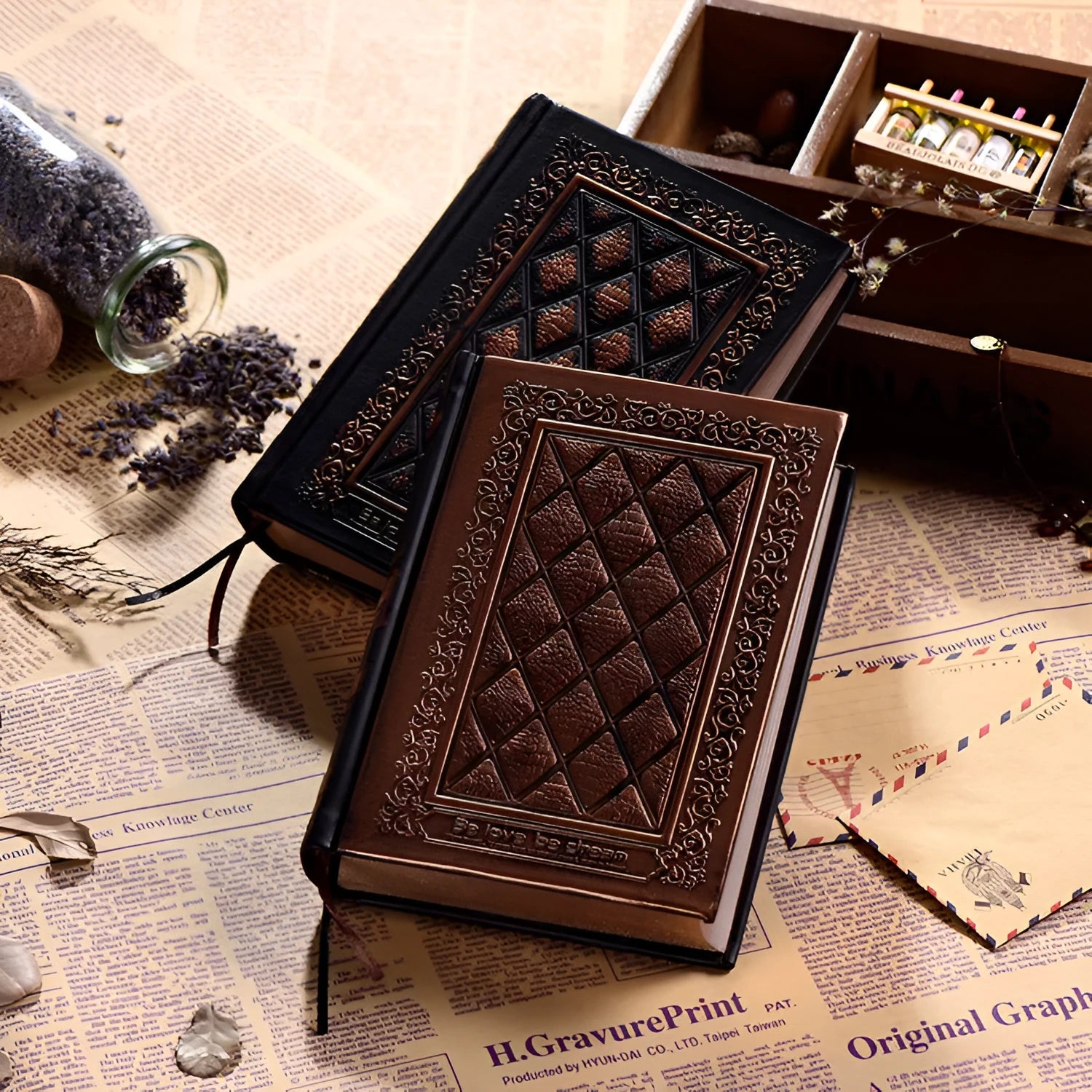 Bronze embossed faux leather A5 notepad with 192 thick unlined pages, lying open.