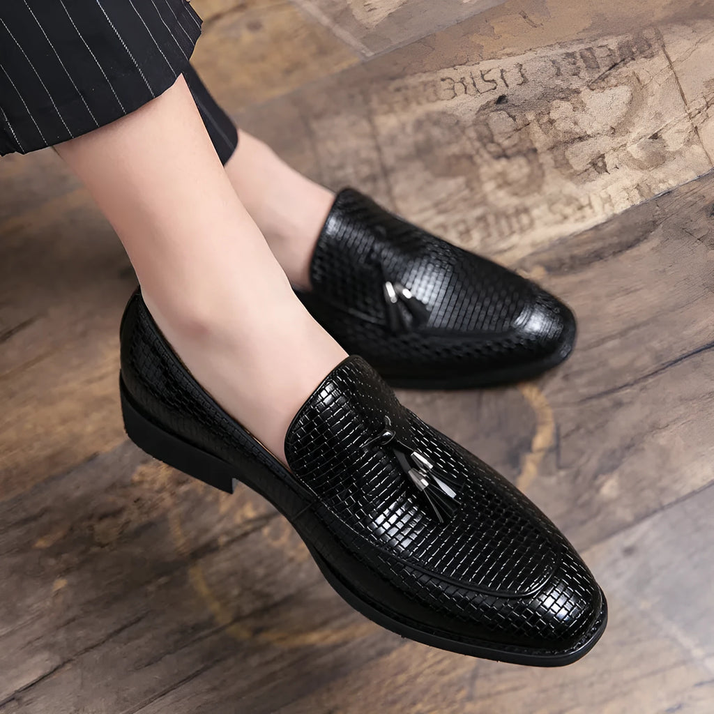 Men's black pointed slip on shoes with tassel detail on artificial PU upper