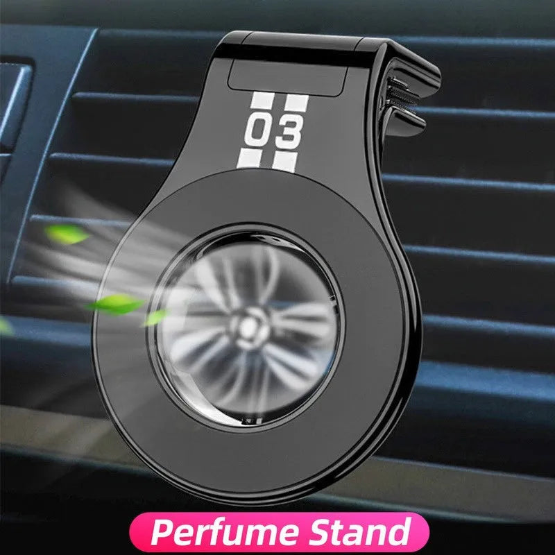 Black magnetic car phone holder attached to a car air vent, holding a smartphone at an angle.