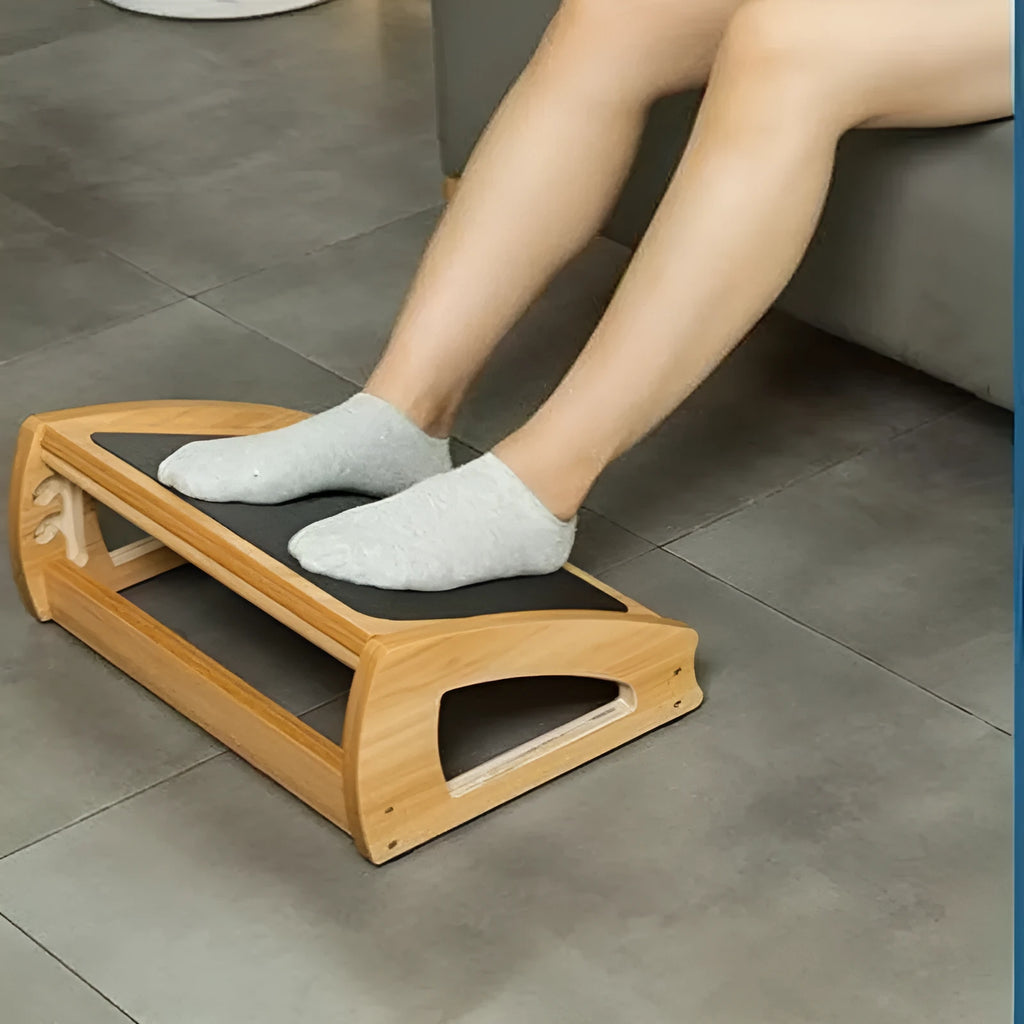Wooden adjustable bamboo office desk footstool in natural wood colour, modern simplicity style.