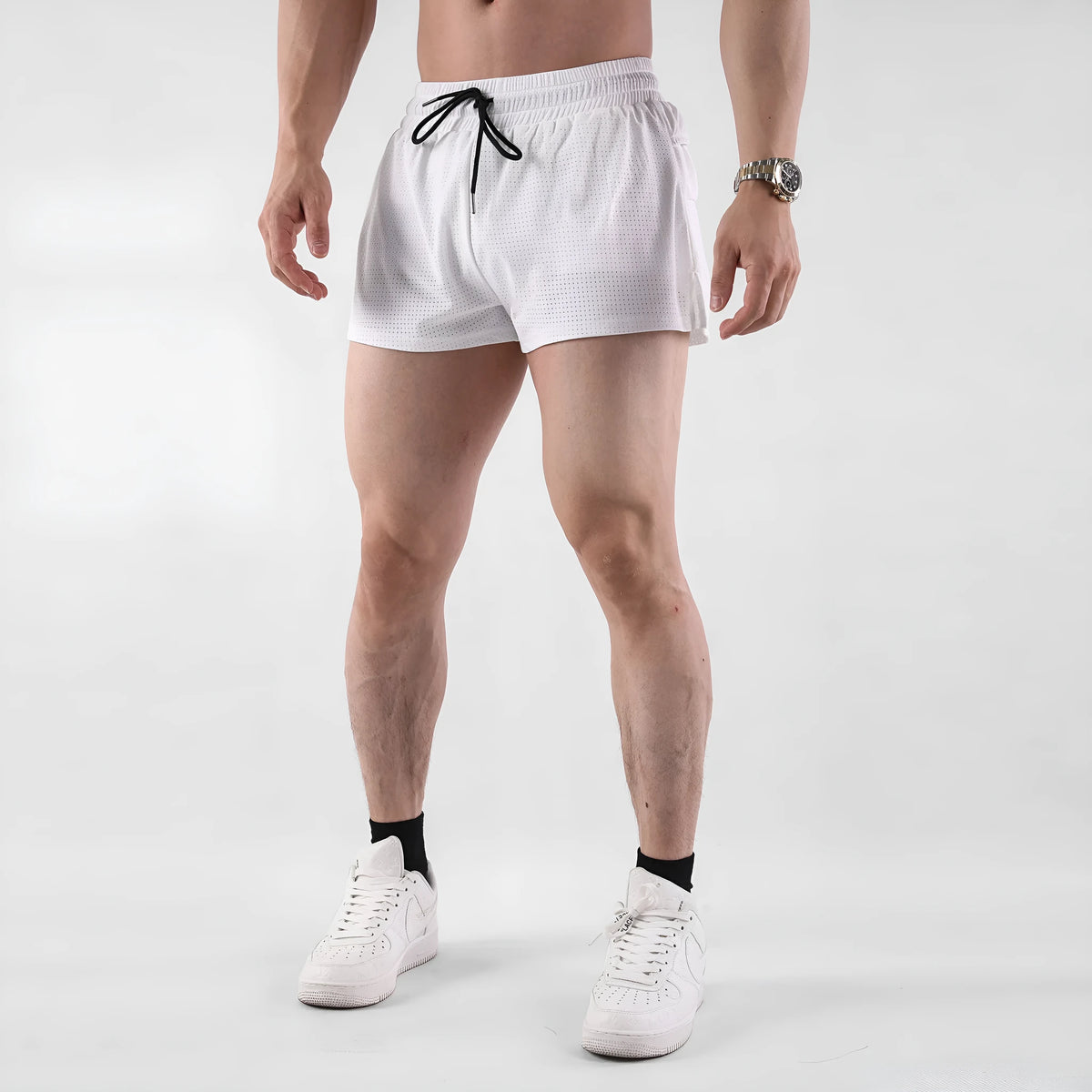 Men's quick-dry nylon shorts in black, shown on a model for summer sports leisure wear.