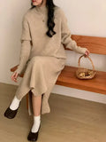Half turtleneck knitted acrylic dress in graphite colour with overknee length and long sleeves.