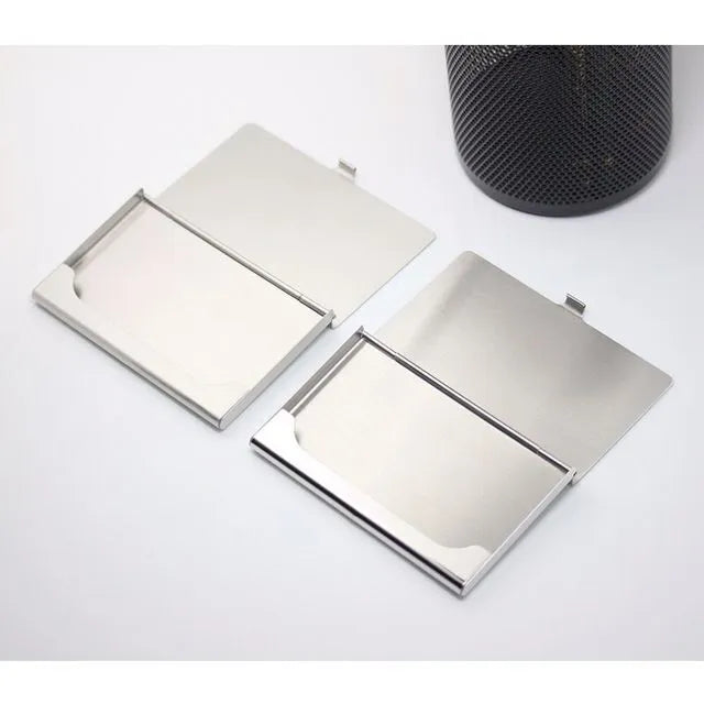 Geometric stainless steel business card case with brushed and mirrored finishes.