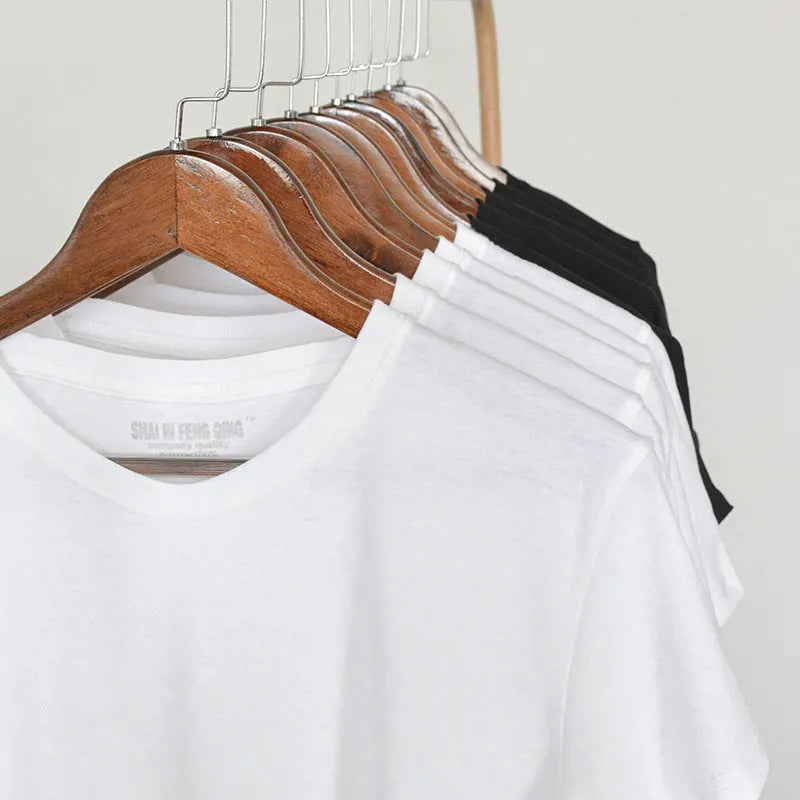 Men's solid colour combed cotton round neck T-shirt on a hanger