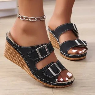 Women's creamy-white wedge beach slippers with an adjustable belt buckle strap and rubber sole