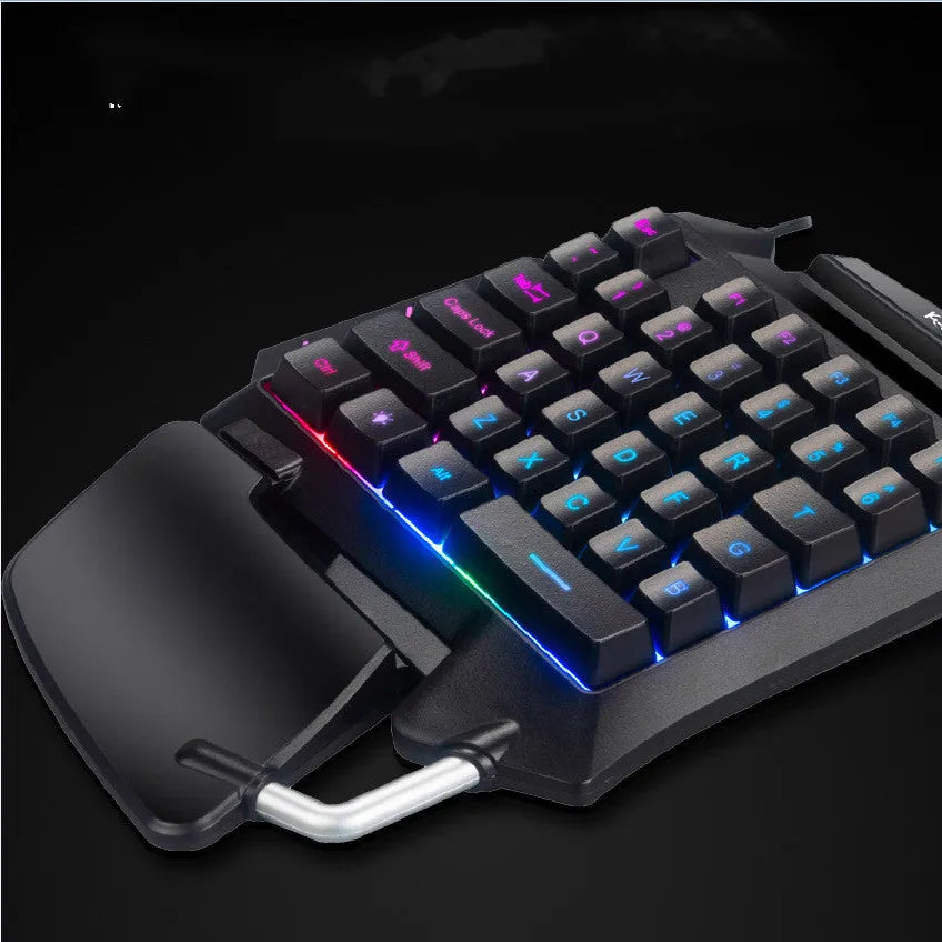 Black one-handed gaming keyboard with integrated left joystick and palm rest