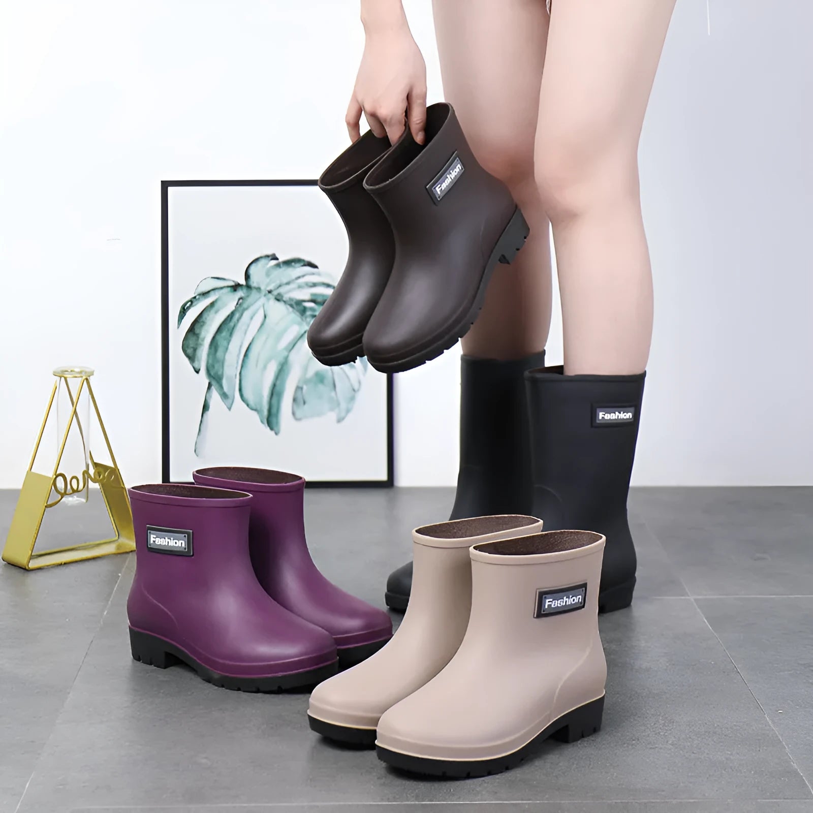 Women's mid-calf rain boot in black PVC with a low heel, shown alongside apricot and brown colour options.