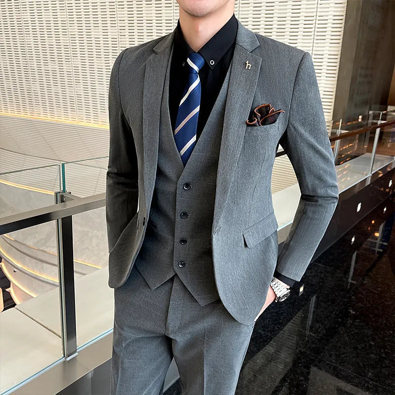 Slim fit men's business suit in black or dark grey cotton blend fabric with adhesive interlining construction