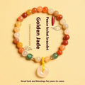Handmade natural jinsi jade and red agate peace clasp bracelet with safety buckle on wrist.