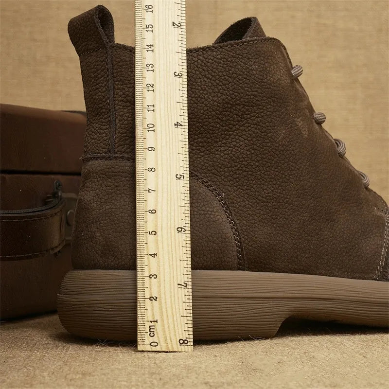 Grey genuine leather Martin boots with wedge heel and front lace-up design.