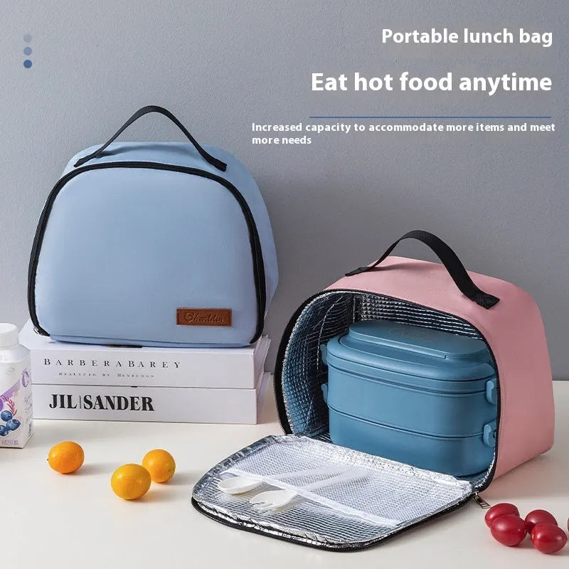 Large insulated lunch box bag in textured cloth, shown in blue colour with a bento box inside.