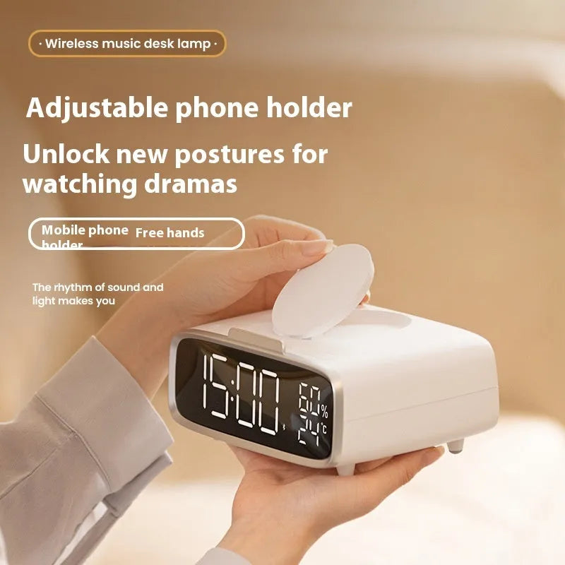 White 3-in-1 bedside unit with wireless charging pad, Bluetooth speaker, and night light.