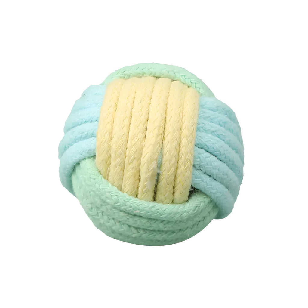 Four small handmade cotton plush balls for cats in assorted two-tone colours, shown next to a ruler for scale.