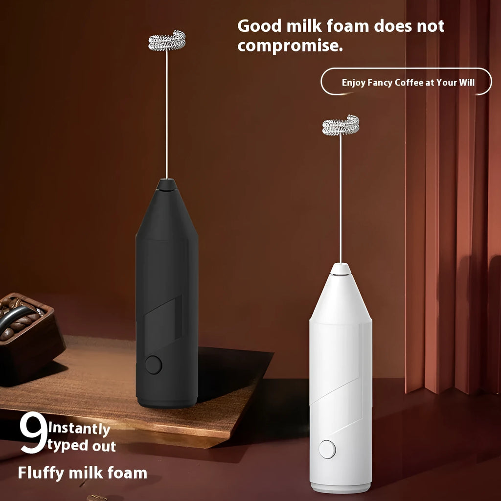 Mini handheld electric milk frother in black, white, and khaki colours with a stainless steel whisk.
