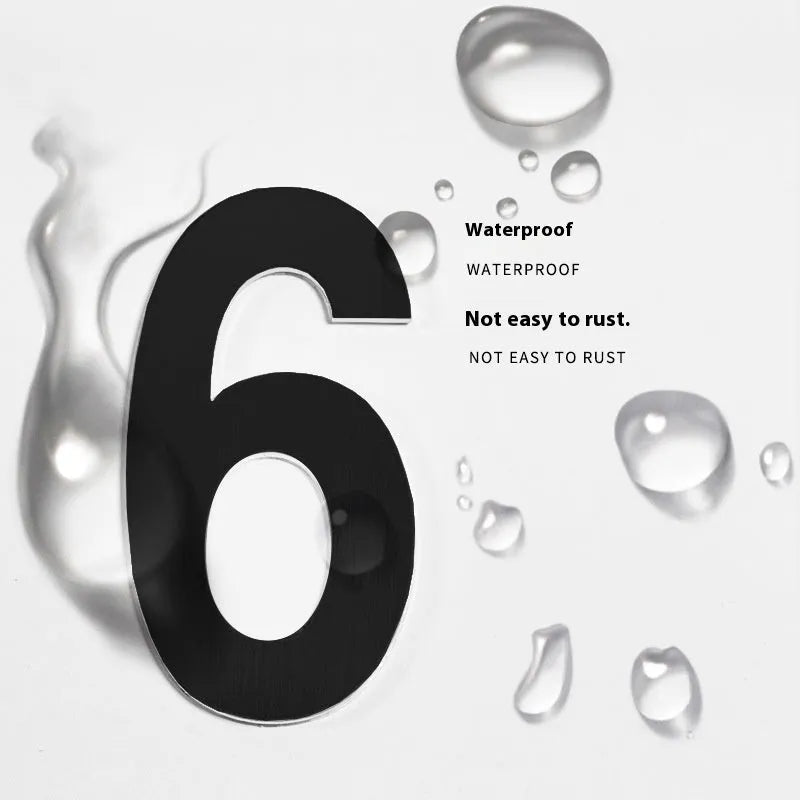 Black stainless steel adhesive house number sign showing the number 7, measuring 7.5cm.