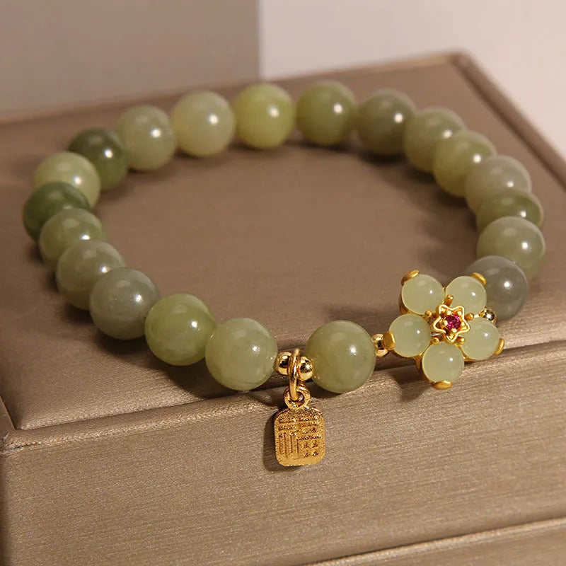 A grey jade coloured alloy bracelet for women in a casual style.