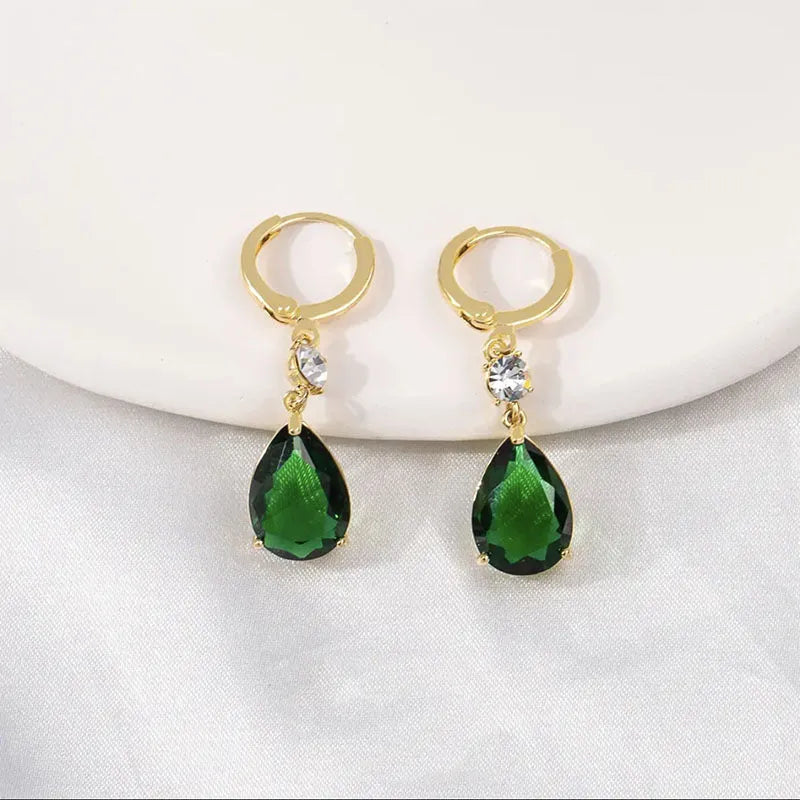 A pair of emerald green geometric teardrop earrings made from lightweight alloy.