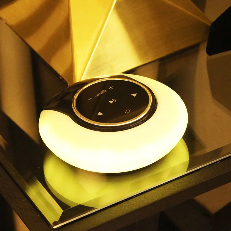 Blue plastic Bluetooth desk lamp speaker with folded LED light and touch controls