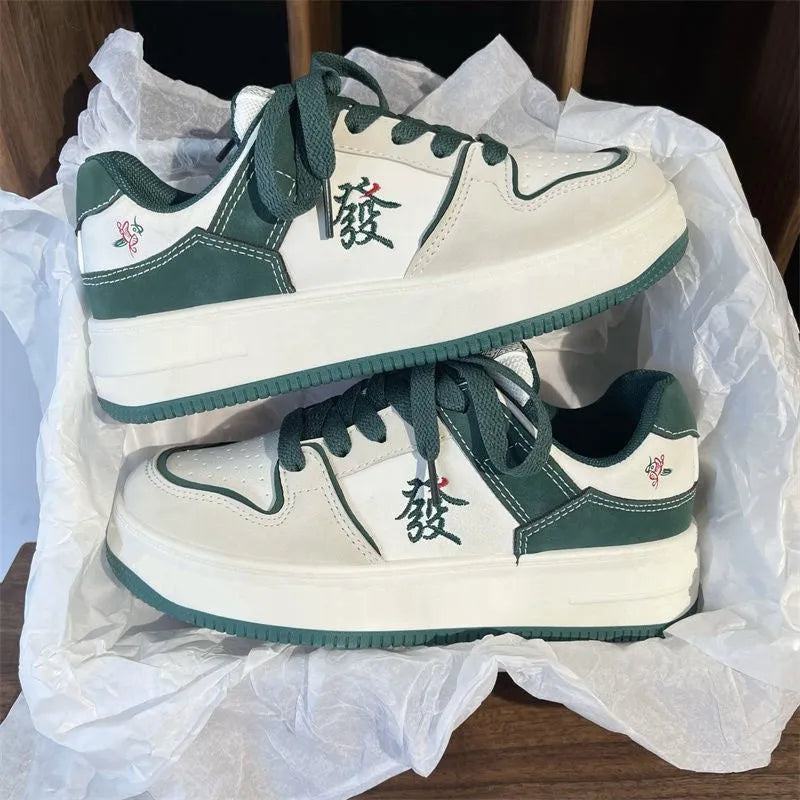 Men's retro low-top sneakers with synthetic PU upper, rubber sole, and colour blocking in green, pink, white, or white black.