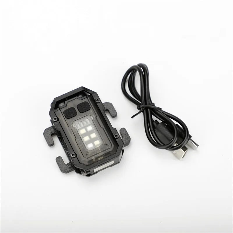 Portable tactical mini warning flashlight with USB charging cable attached for backpack mounting