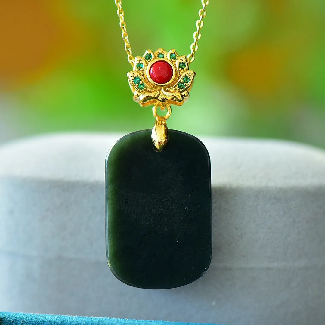 Flat ink blue Hetian Jade pendant with copper inlay design on a chain.