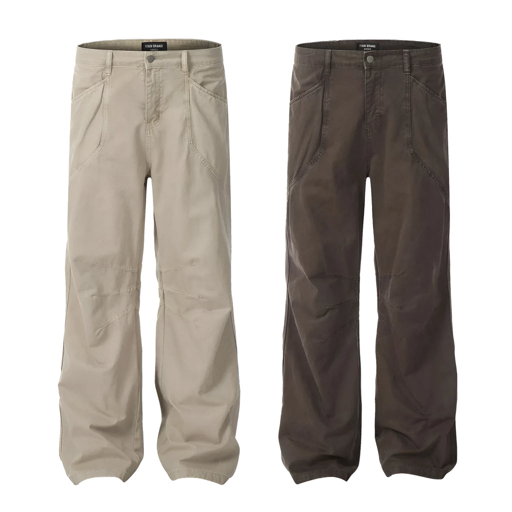 Men's brown straight-leg jeans with high waist and zip fly on mannequin