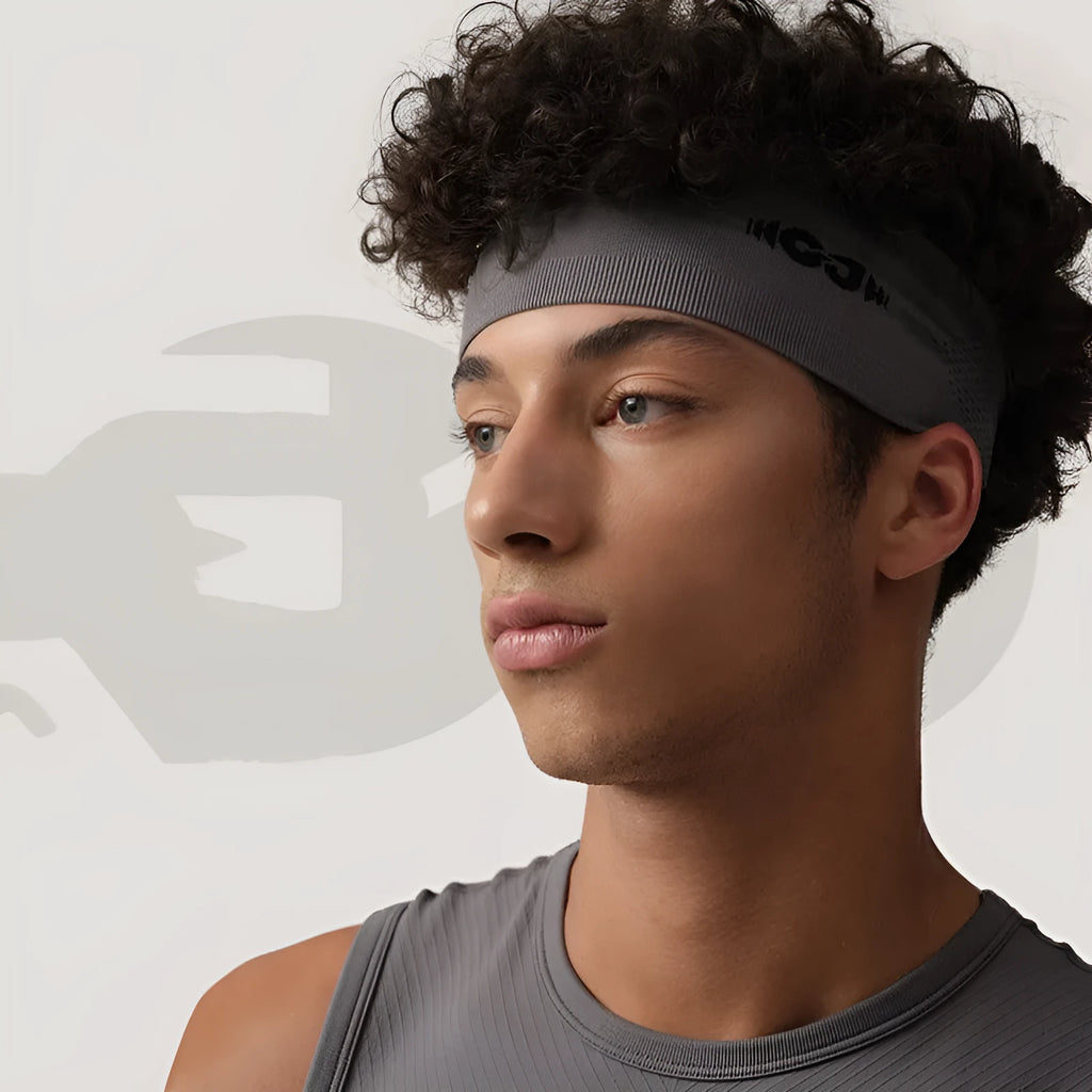 Seamless knitted exercise hair band in classic black on grey background
