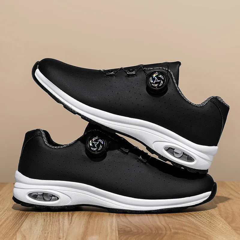 Low top tennis shoes in black with mesh upper, cross shoulder straps, and composite sole