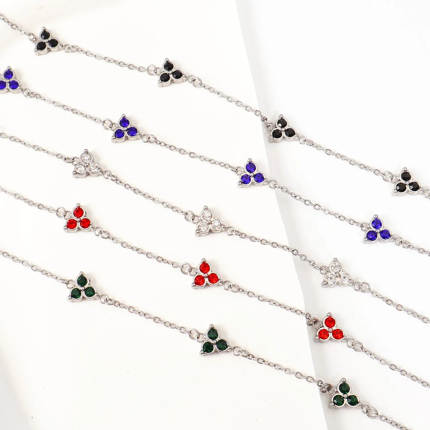 Women's stainless steel geometric triangle bracelet with three diamond stones and adjustable chain