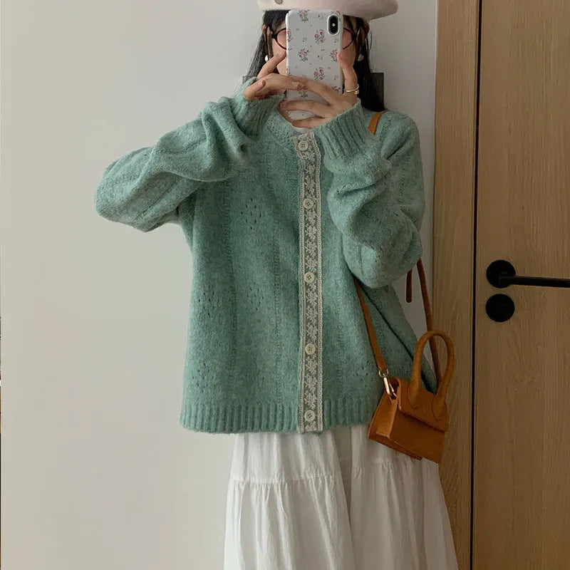 Loose artistic retro knitted cardigan coat in viscose fibre, shown in apricot colour.