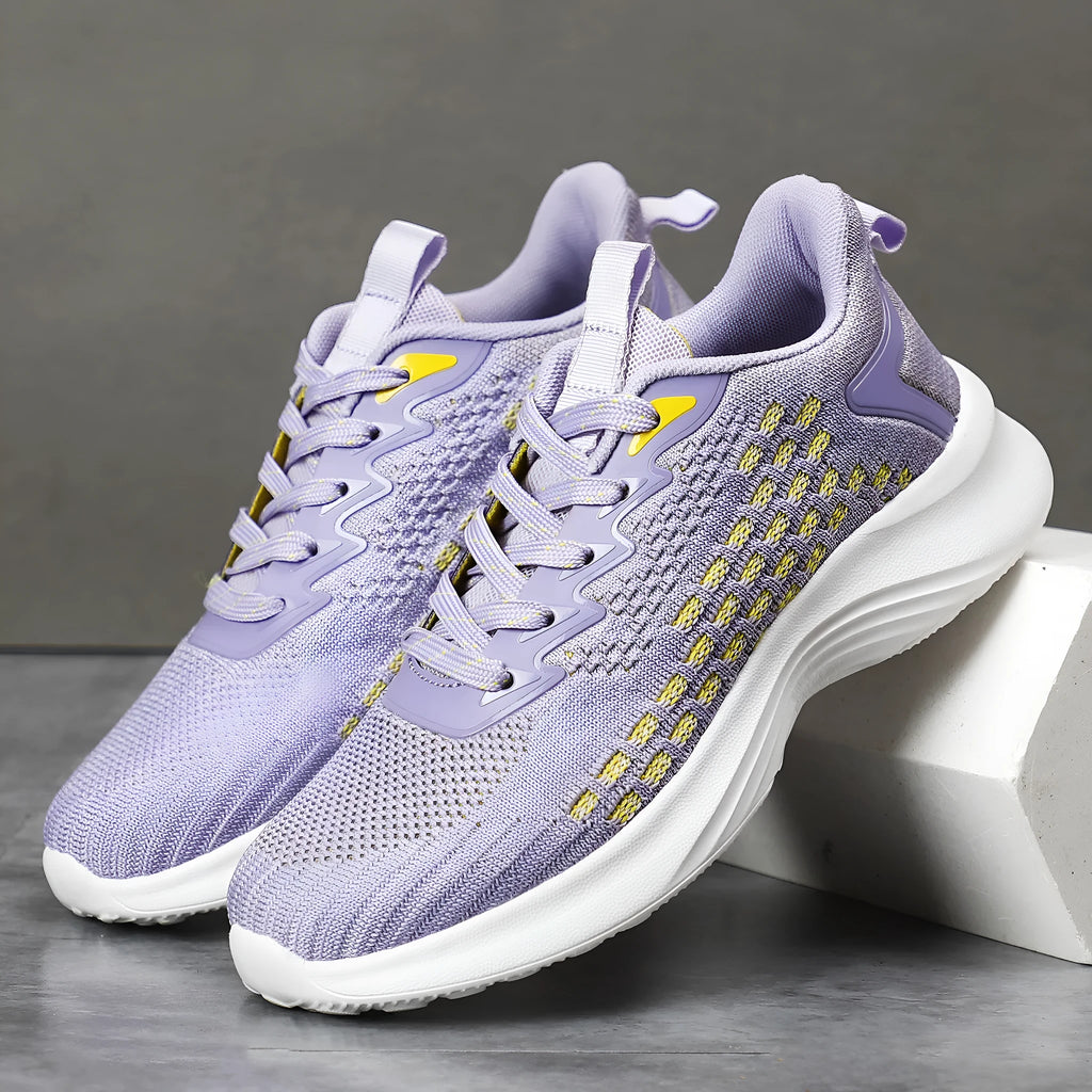 Women's lavender purple Flyknit running shoes with striped pattern and mesh upper on a white background.