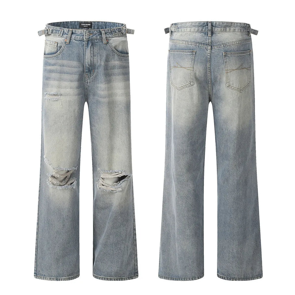 Man wearing blue retro-style straight-leg jeans with a ripped, distressed finish on the legs.