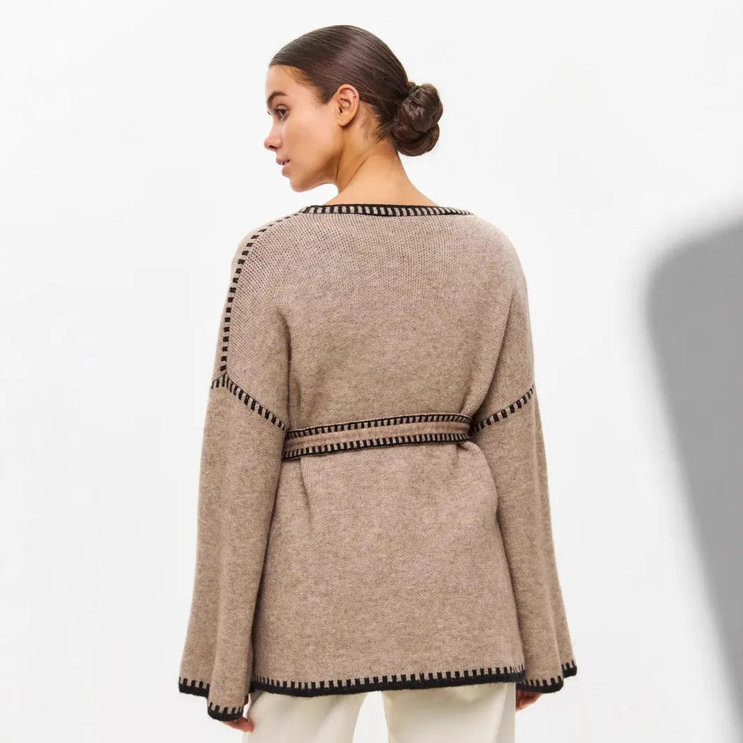 Loose fit knitted cardigan sweater in black, camel, or white colour on a hanger