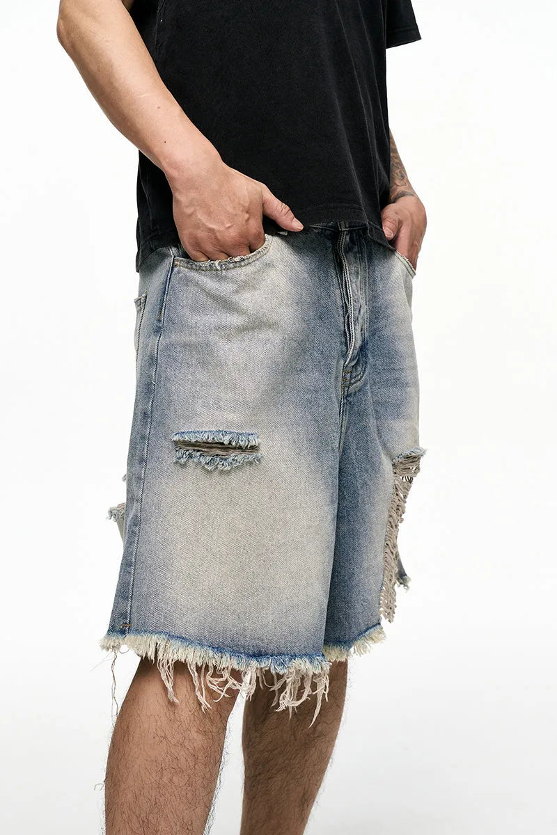 Men's light blue baggy denim shorts with wide legs and retro washed colour.