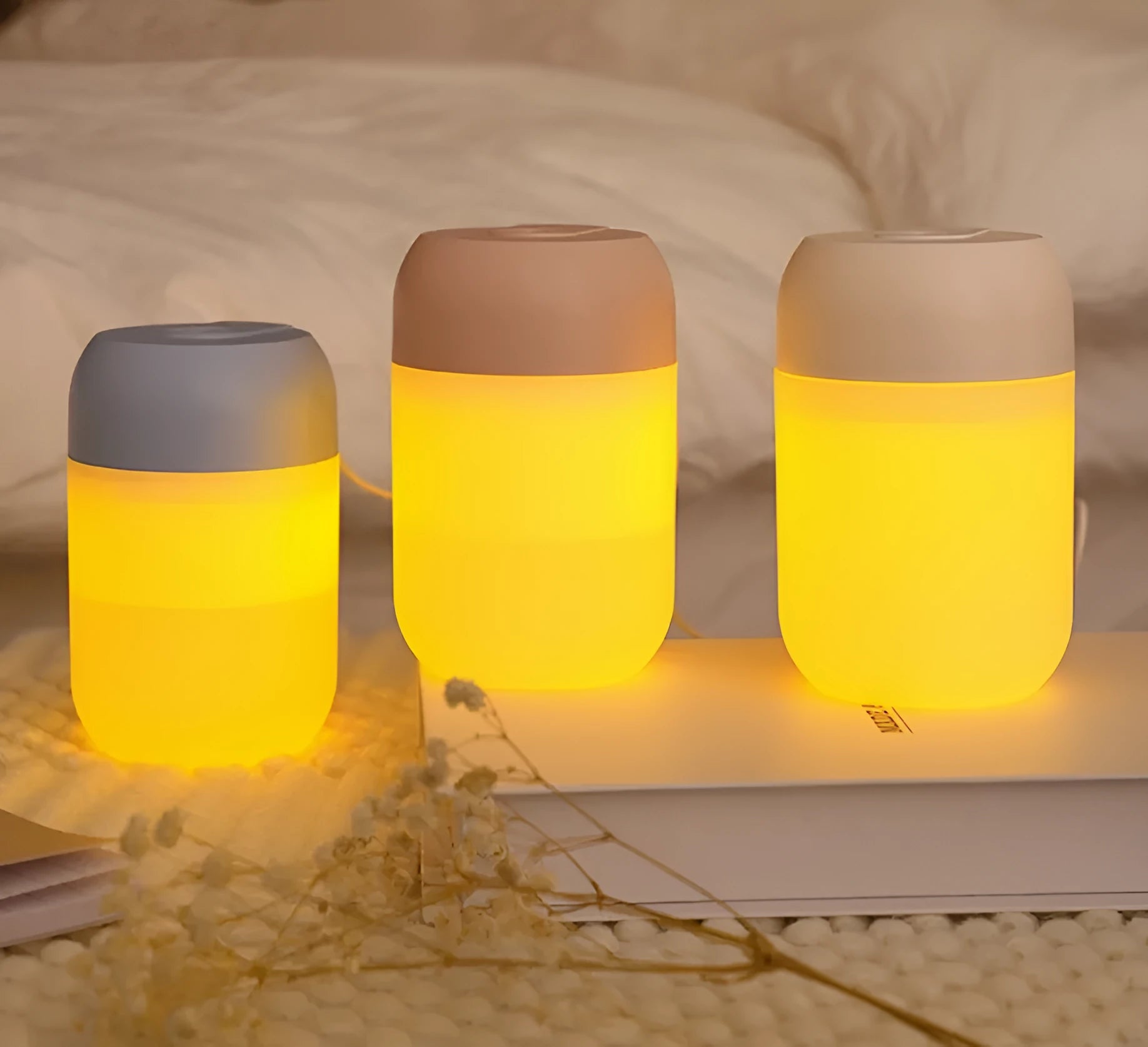 White cylindrical USB-powered mini humidifier with charging cable