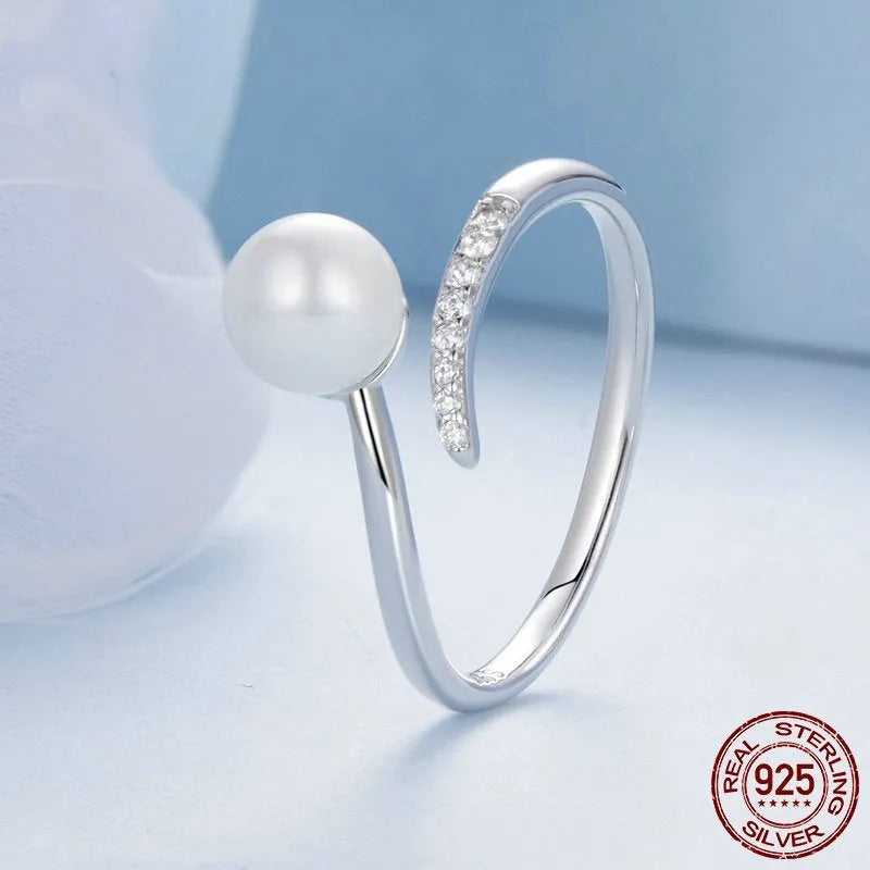Sterling silver adjustable ring with natural shell pearls on open band design
