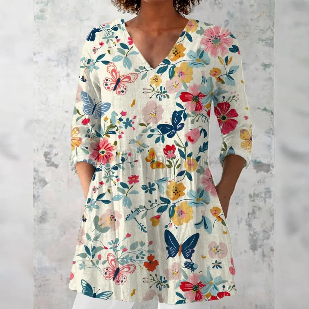 Women's retro style slim fit long-sleeved top with a printed design, shown on a hanger.