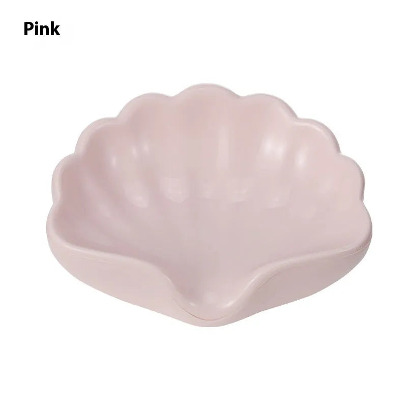 Plastic shell-shaped soap dish in pearl white or pink for bathroom use