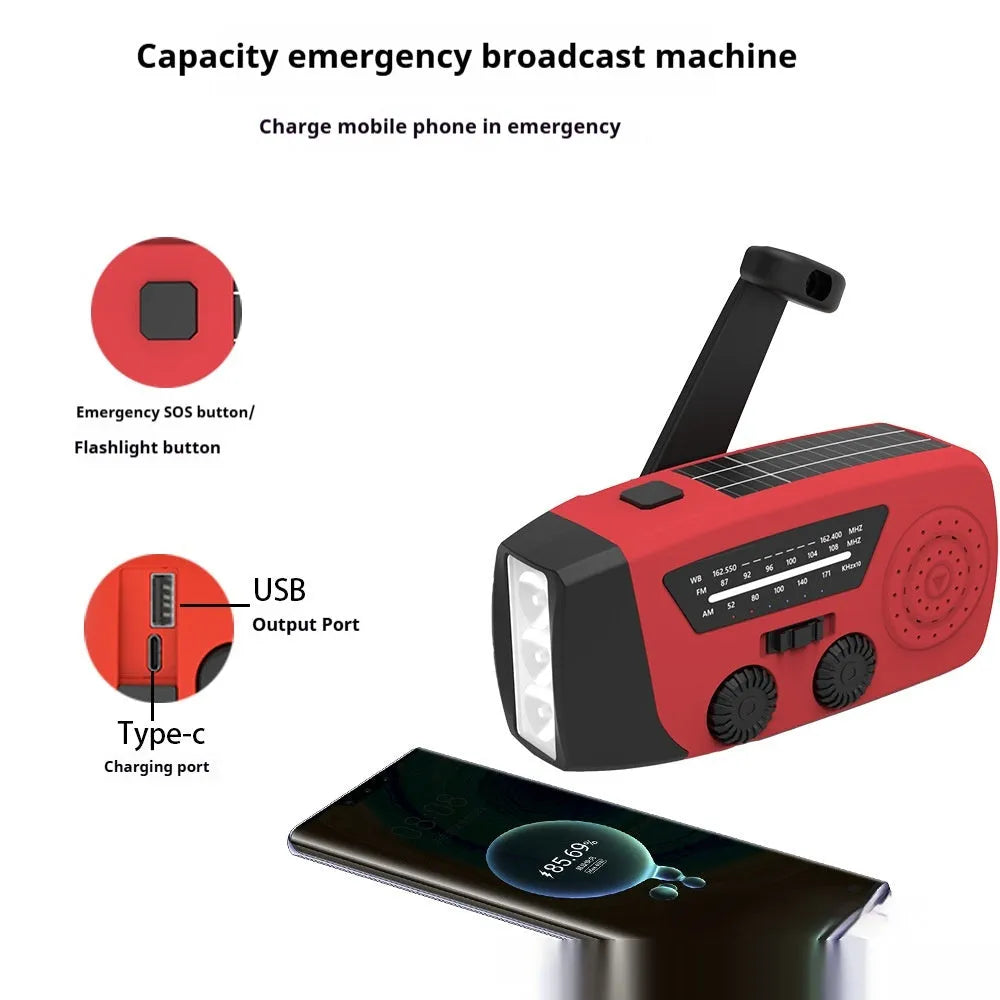 Red rechargeable emergency hand radio with torch, hand crank, and wrist strap on a white background.