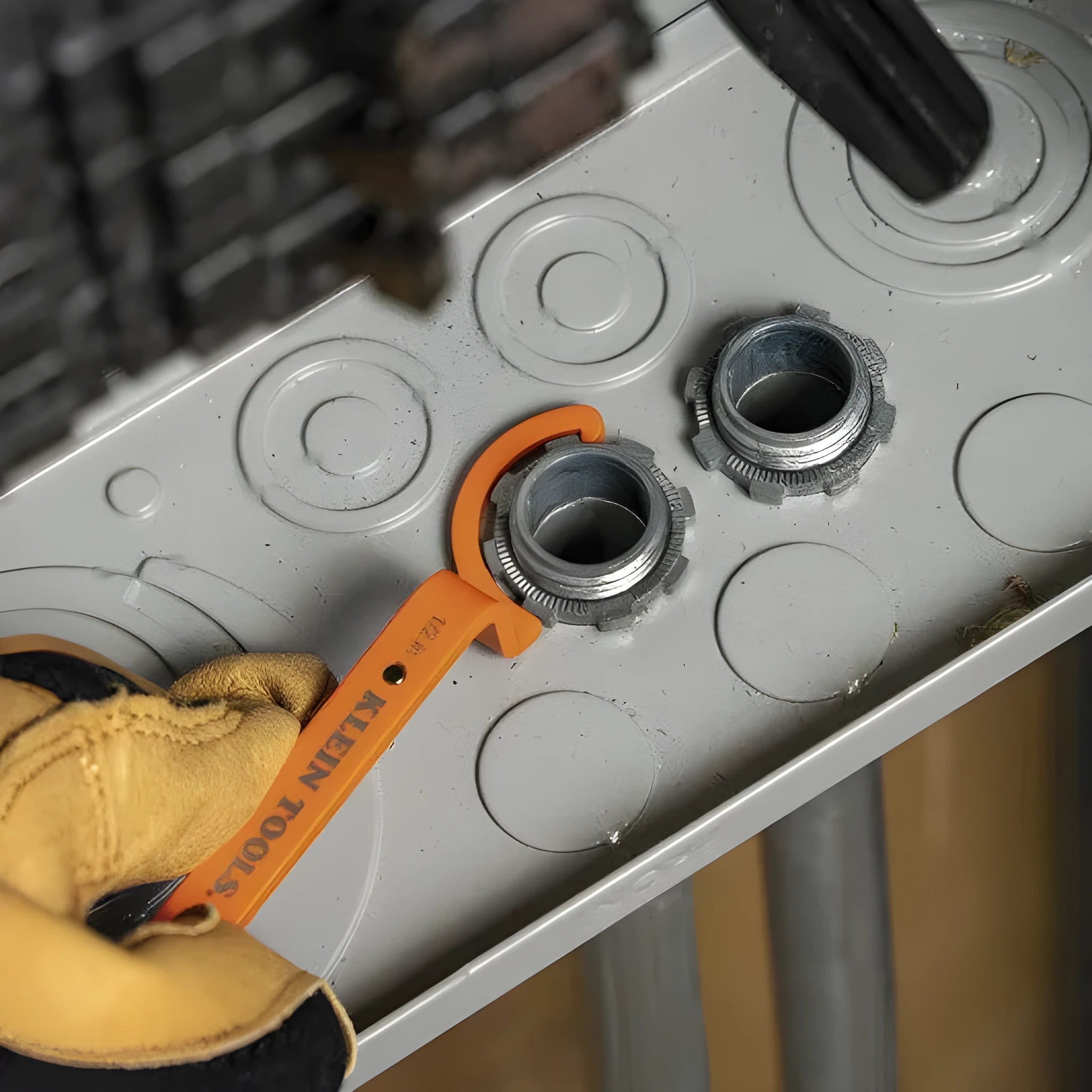 Three colour-coded magnetic crescent wrenches with suction cups - orange, grey, and black spanner set