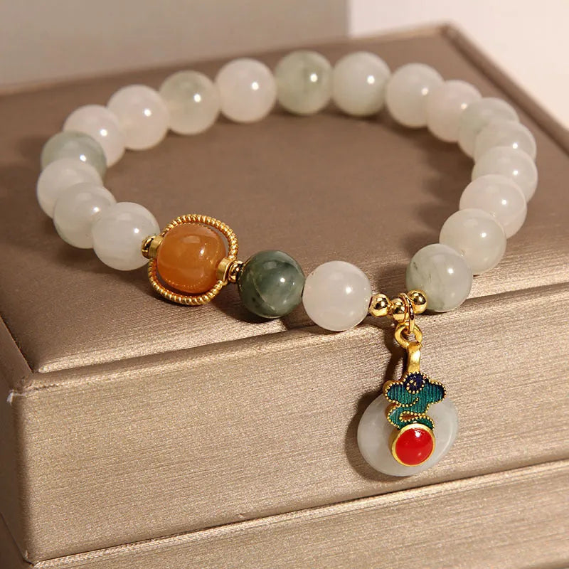 Women's ice jade bracelet with pearl accents and a jade buckle on a retro design.