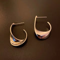Twisted geometric metal earrings with gold or silver electroplated finish