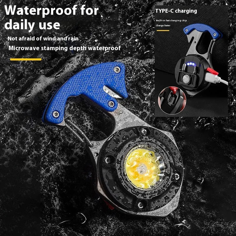 Compact silver and black multifunctional keychain flashlight with keyring, COB LED panel, and window breaker tool.